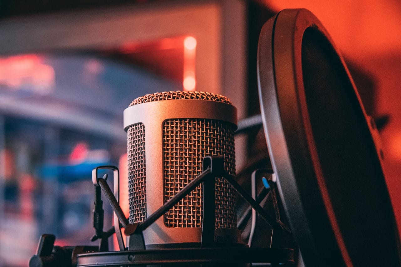 The microphone is the most important thing on the desk.
